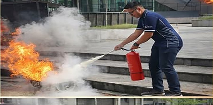 Fire safety drill — extinguishing a controlled flame